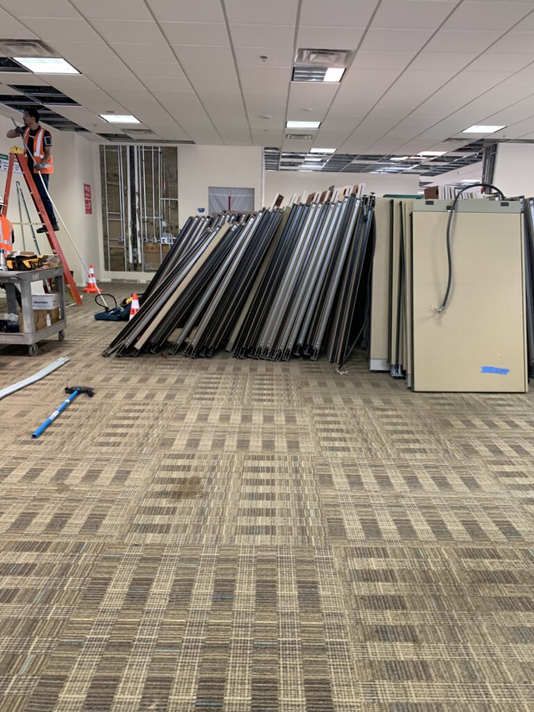 Dismantling existing workstations for disposal and sale.